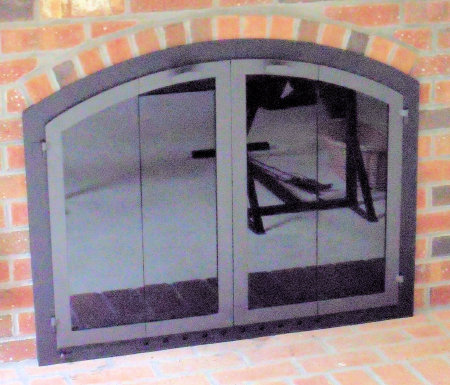 Nantucket Arch Black frame, charcoal (aka darken steel) vice bifold doors, standard smoke glass and gate mesh spark screens.